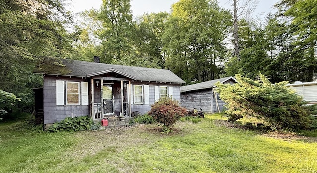 70 E Hill Rd, Canton, CT 06019 - bungalow-style house featuring a front lawn, a chimney, and a shingled roof