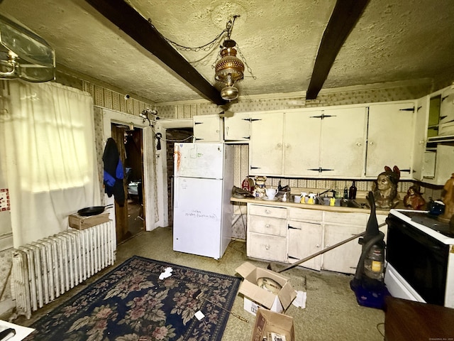 70 E Hill Rd, Canton, CT 06019 - kitchen with white appliances, beam ceiling, radiator, white cabinetry, and a textured ceiling