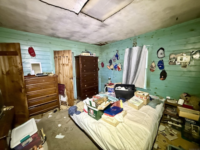 70 E Hill Rd, Canton, CT 06019 - bedroom featuring wooden walls and concrete floors