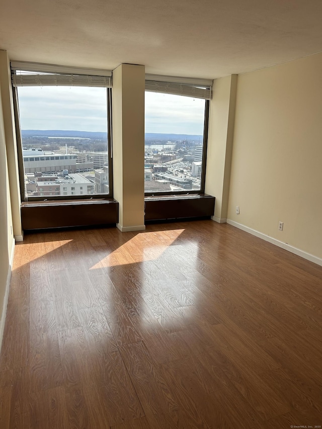 1 Gold St Apt 21G, Hartford, CT 06103 - spare room featuring wood finished floors and baseboards