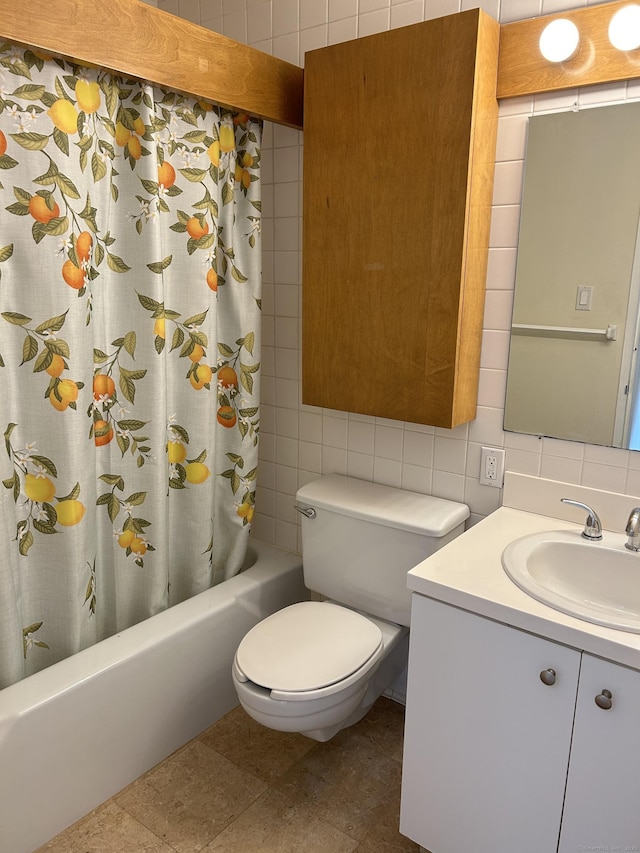 1 Gold St Apt 21G, Hartford, CT 06103 - bathroom with tile walls, shower / bathtub combination with curtain, toilet, vanity, and decorative backsplash