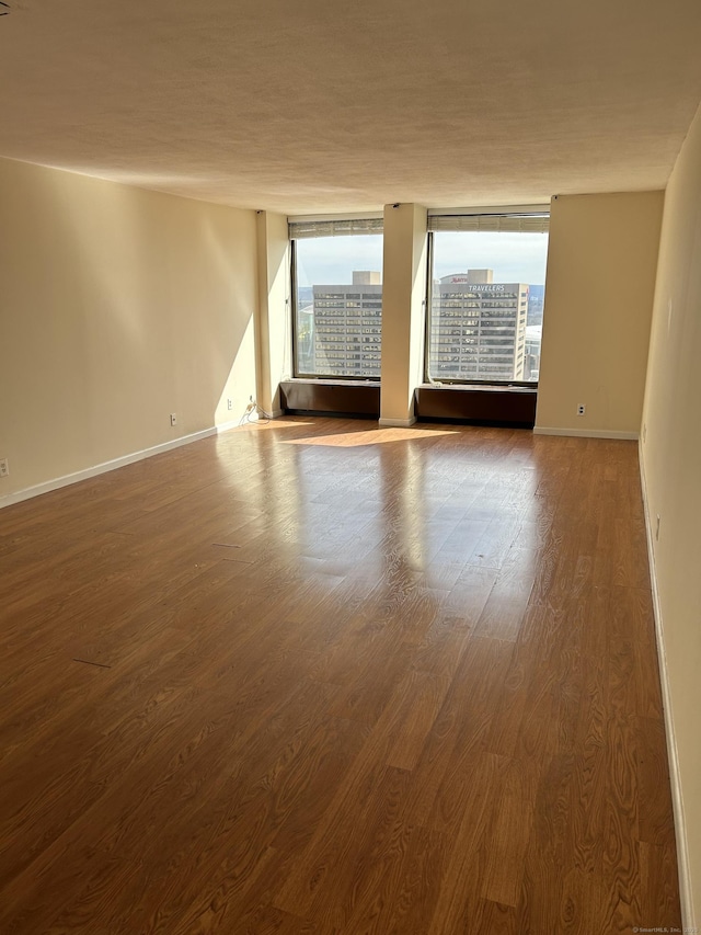 1 Gold St Apt 21G, Hartford, CT 06103 - spare room featuring wood finished floors and baseboards