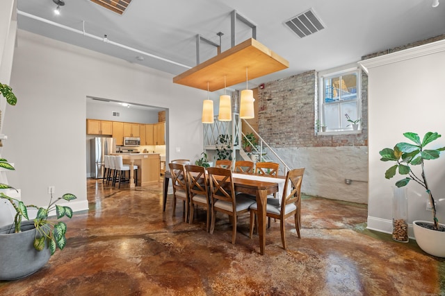 43 Chestnut St Unit 60, New Haven, CT 06511 - dining area featuring finished concrete flooring and baseboards