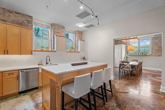 43 Chestnut St Unit 60, New Haven, CT 06511 - kitchen featuring stainless steel dishwasher, finished concrete floors, a sink, decorative backsplash, and track lighting