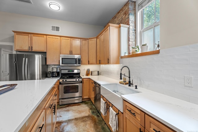 43 Chestnut St Unit 60, New Haven, CT 06511 - kitchen featuring stainless steel appliances, a sink, tasteful backsplash, and light stone countertops