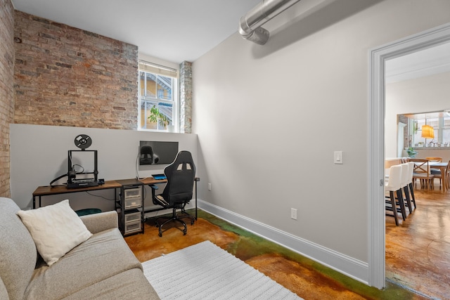 43 Chestnut St Unit 60, New Haven, CT 06511 - home office featuring concrete floors, brick wall, and baseboards