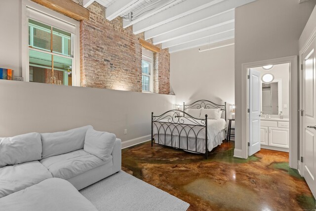 43 Chestnut St Unit 60, New Haven, CT 06511 - bedroom with finished concrete flooring, brick wall, baseboards, a high ceiling, and beamed ceiling