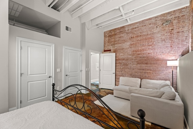 43 Chestnut St Unit 60, New Haven, CT 06511 - bedroom featuring brick wall, a high ceiling, beam ceiling, and baseboards