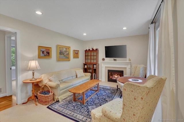 19 Oak Leaf Cir, Coventry, CT 06238 - living area with a glass covered fireplace, baseboards, recessed lighting, and wood finished floors