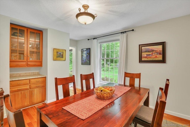 19 Oak Leaf Cir, Coventry, CT 06238 - dining space with light wood-style flooring and baseboards