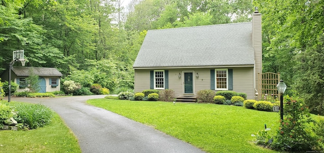 19 Oak Leaf Cir, Coventry, CT 06238 - cape cod-style house with a chimney and a front lawn