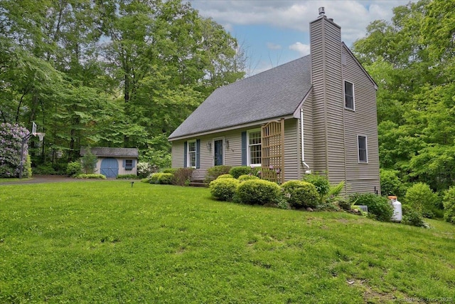 19 Oak Leaf Cir, Coventry, CT 06238 - view of front of property with a chimney, a front yard, and roof with shingles