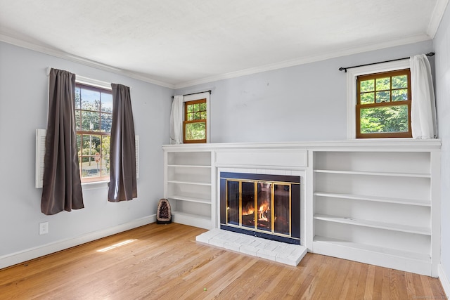 54 Briarwood Rd, Newington, CT 06111 - unfurnished living room featuring healthy amount of natural light, ornamental molding, wood finished floors, a glass covered fireplace, and baseboards