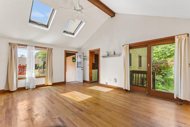 54 Briarwood Rd, Newington, CT 06111 - unfurnished living room with high vaulted ceiling, a ceiling fan, beam ceiling, a skylight, and light wood-style flooring