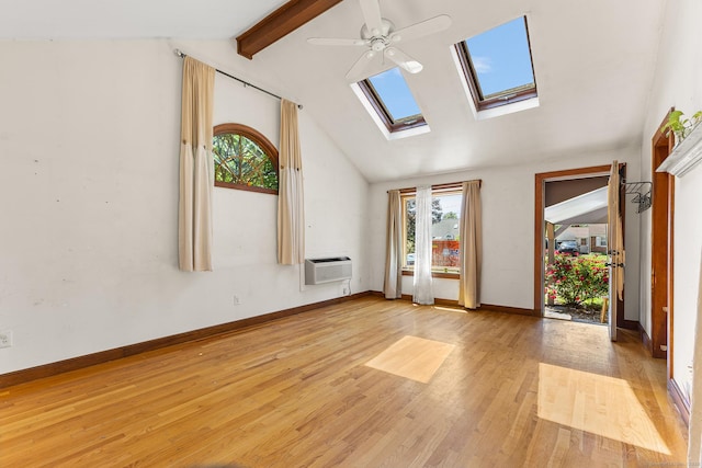 54 Briarwood Rd, Newington, CT 06111 - unfurnished living room featuring a skylight, light wood-style floors, a ceiling fan, an AC wall unit, and baseboards
