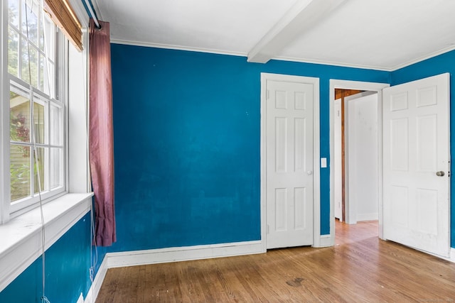 54 Briarwood Rd, Newington, CT 06111 - spare room with baseboards, beam ceiling, wood finished floors, and ornamental molding