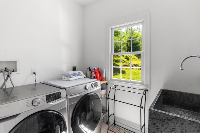 3 Autumn Ridge Rd, Newtown, CT 06470 - laundry area featuring healthy amount of natural light, washer and clothes dryer, and light tile patterned floors