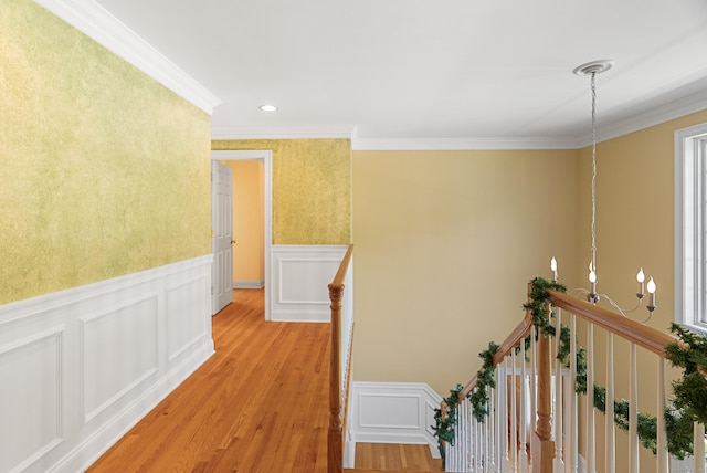 3 Autumn Ridge Rd, Newtown, CT 06470 - corridor featuring an upstairs landing, crown molding, light wood-style floors, a decorative wall, and wainscoting