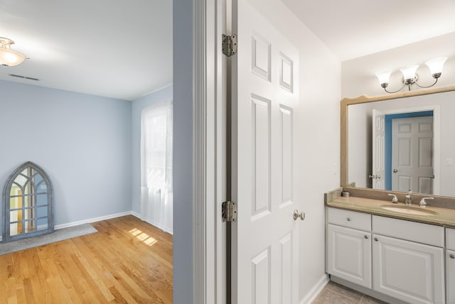 3 Autumn Ridge Rd, Newtown, CT 06470 - bathroom with vanity, baseboards, and wood finished floors