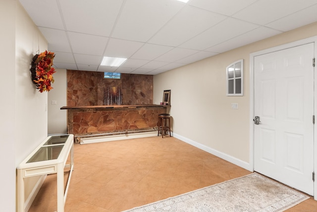 3 Autumn Ridge Rd, Newtown, CT 06470 - finished below grade area with a paneled ceiling, baseboards, and a bar