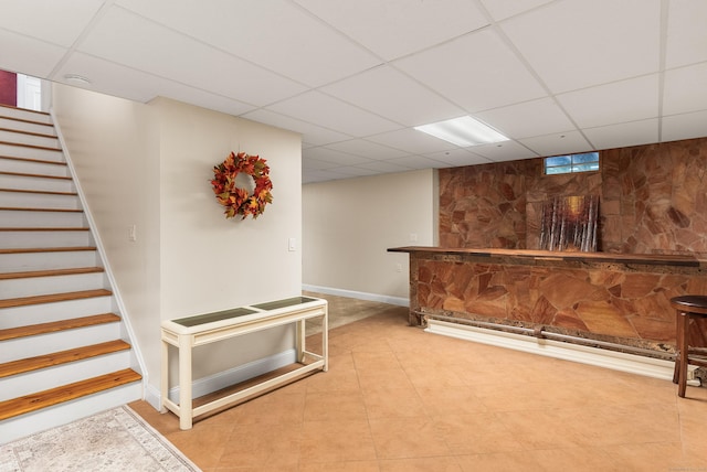 3 Autumn Ridge Rd, Newtown, CT 06470 - indoor dry bar featuring a paneled ceiling, stairs, baseboards, and tile patterned flooring
