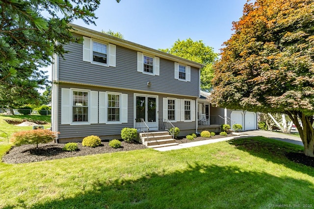 59 Valley Dr, Berlin, CT 06037 - colonial inspired home with concrete driveway, a garage, and a front lawn