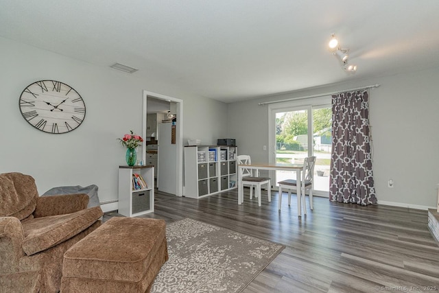 59 Valley Dr, Berlin, CT 06037 - living area featuring wood finished floors, a baseboard heating unit, and baseboards
