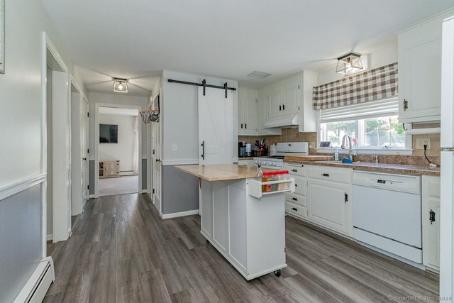59 Valley Dr, Berlin, CT 06037 - kitchen featuring white appliances, baseboard heating, a sink, under cabinet range hood, and dark wood-style flooring