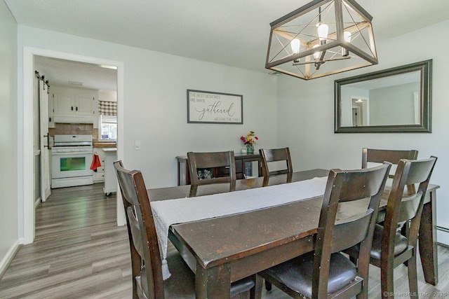59 Valley Dr, Berlin, CT 06037 - dining space featuring wood finished floors and a chandelier