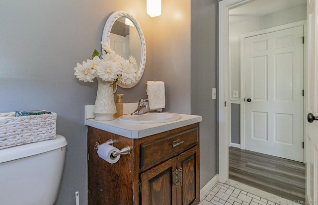 59 Valley Dr, Berlin, CT 06037 - half bathroom with vanity, toilet, and baseboards