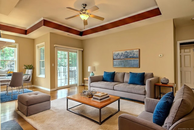 35 Todd St Unit 204, Hamden, CT 06518 - living area featuring wood finished floors, a tray ceiling, healthy amount of natural light, ceiling fan, and ornamental molding