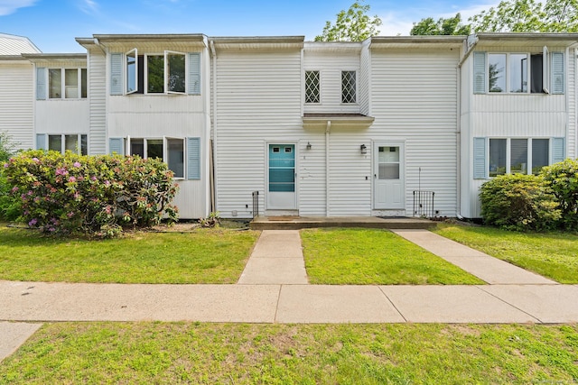 122 W Main St Apt E, Stafford, CT 06076 - view of property with a front lawn