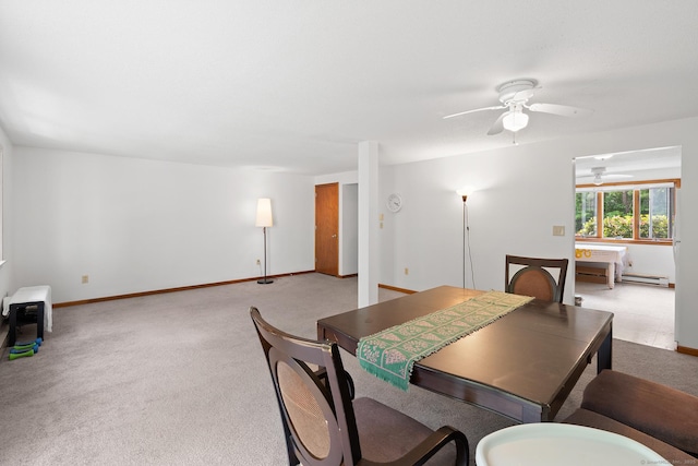 122 W Main St Apt E, Stafford, CT 06076 - dining room featuring ceiling fan, carpet floors, baseboard heating, and baseboards
