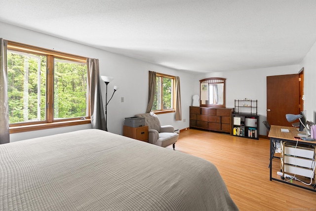 122 W Main St Apt E, Stafford, CT 06076 - bedroom with light wood-style floors
