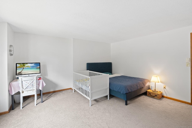 122 W Main St Apt E, Stafford, CT 06076 - carpeted bedroom with baseboards
