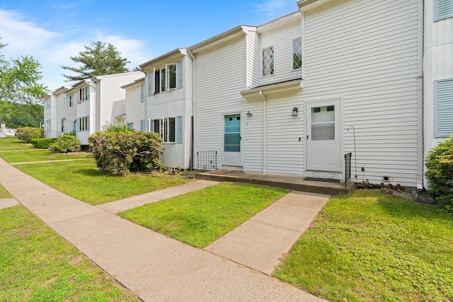 122 W Main St Apt E, Stafford, CT 06076 - view of front of property featuring a front lawn
