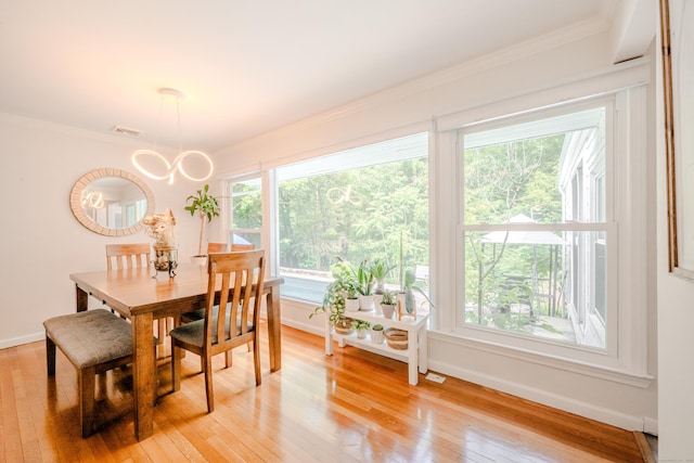 11 Walker Ln, Woodbridge, CT 06525 - dining space featuring ornamental molding, baseboards, light wood finished floors, and a chandelier