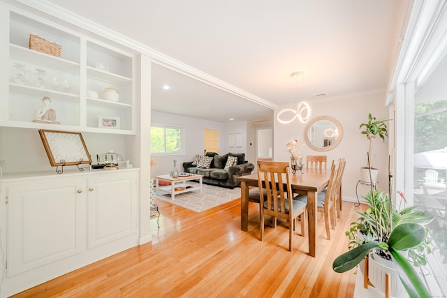 11 Walker Ln, Woodbridge, CT 06525 - dining space featuring light wood-type flooring, a chandelier, ornamental molding, and baseboards