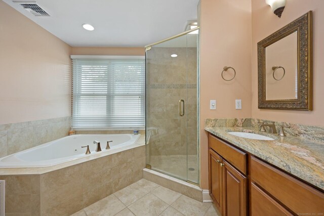 15 Oakledge Cir, Norwalk, CT 06854 - full bath with a garden tub, vanity, a shower stall, and tile patterned flooring