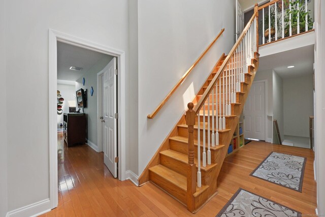 15 Oakledge Cir, Norwalk, CT 06854 - stairs featuring hardwood / wood-style floors and a high ceiling