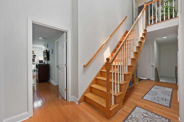 15 Oakledge Cir, Norwalk, CT 06854 - staircase with wood-type flooring and a towering ceiling