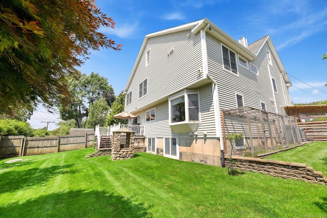 15 Oakledge Cir, Norwalk, CT 06854 - rear view of house featuring a deck, a chimney, and stairway