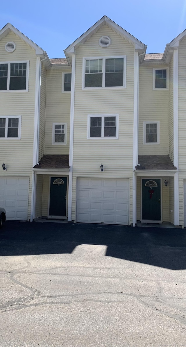 527 W Thames St Unit 74, Norwich, CT 06360 - view of front of home featuring asphalt driveway and an attached garage