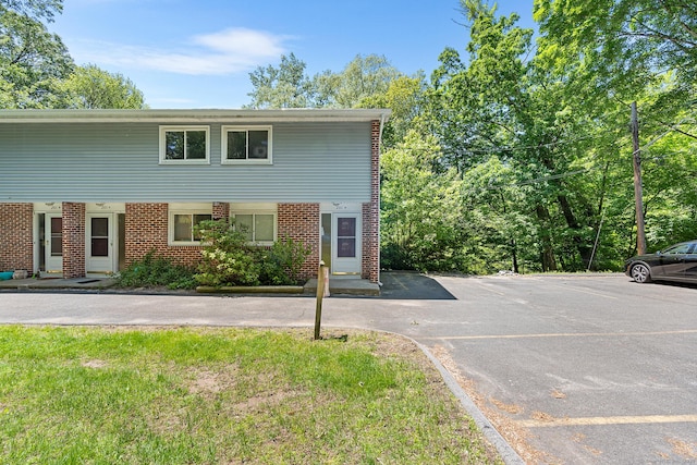 201 Baxter Rd Apt D, Mansfield, CT 06268 - multi unit property featuring brick siding and uncovered parking