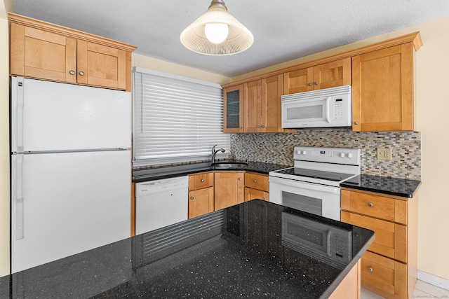 201 Baxter Rd Apt D, Mansfield, CT 06268 - kitchen featuring white appliances, a sink, tasteful backsplash, and dark stone counters