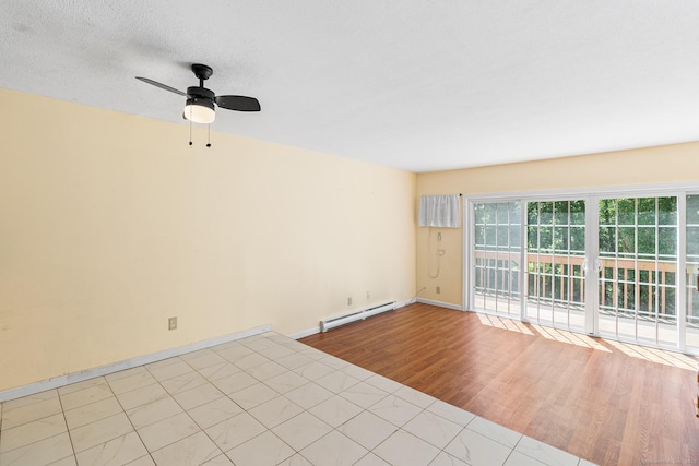 201 Baxter Rd Apt D, Mansfield, CT 06268 - spare room featuring a baseboard heating unit, a ceiling fan, wood finished floors, and baseboards
