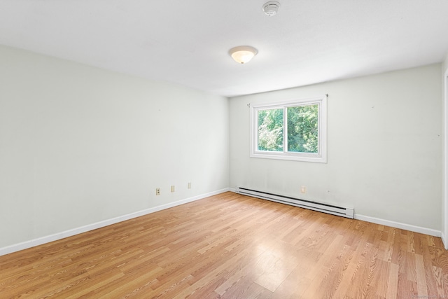 201 Baxter Rd Apt D, Mansfield, CT 06268 - unfurnished room featuring a baseboard radiator, light wood-style flooring, and baseboards
