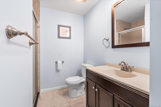 201 Baxter Rd Apt D, Mansfield, CT 06268 - full bathroom with a shower stall, vanity, toilet, baseboards, and tile patterned flooring