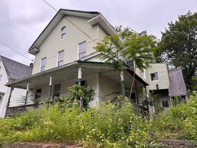 29 Division St, Norwich, CT 06360 - view of side of home with covered porch