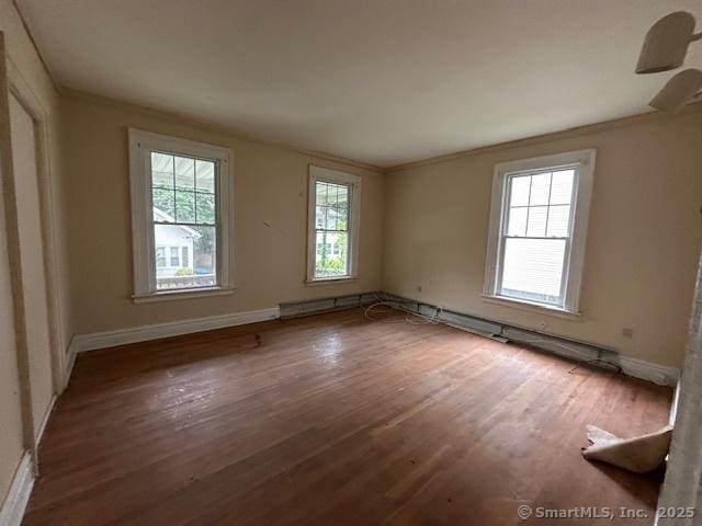 29 Division St, Norwich, CT 06360 - empty room with wood finished floors and crown molding